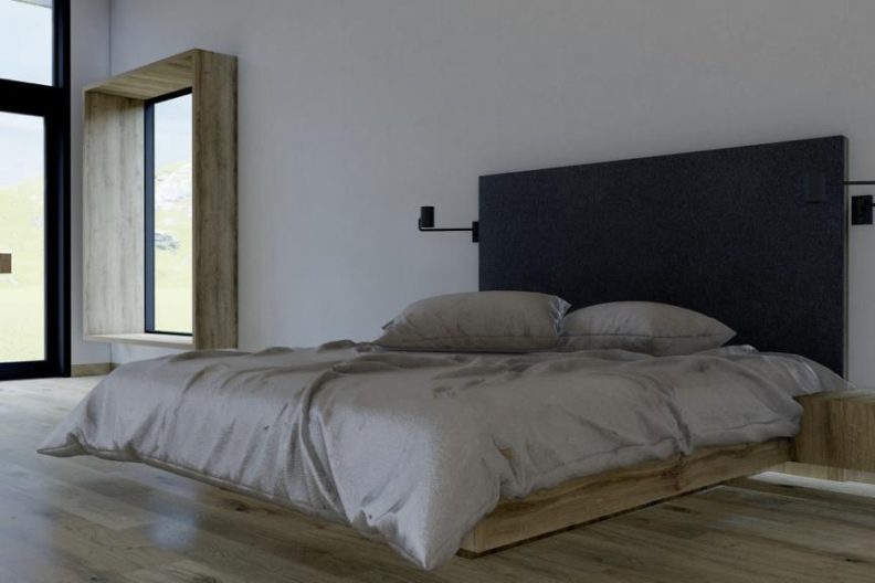 Aufnahme eines modernen Zimmers mit großem und gemütlichem Bett